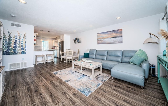 living room with dark hardwood / wood-style floors