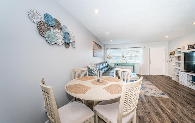 dining space featuring dark hardwood / wood-style flooring