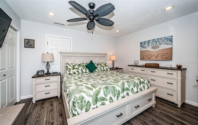 bedroom featuring ceiling fan and dark hardwood / wood-style flooring