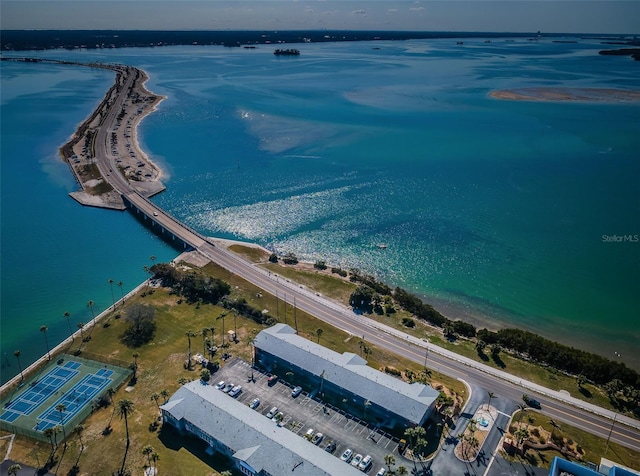 drone / aerial view featuring a water view and a view of the beach