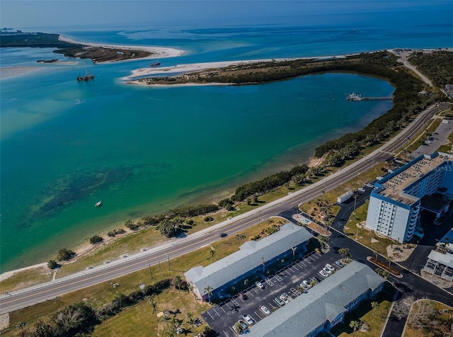 bird's eye view featuring a water view and a view of the beach