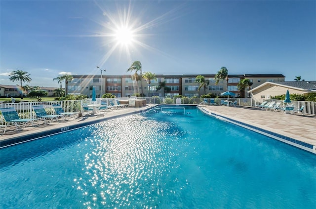 view of swimming pool with a patio area