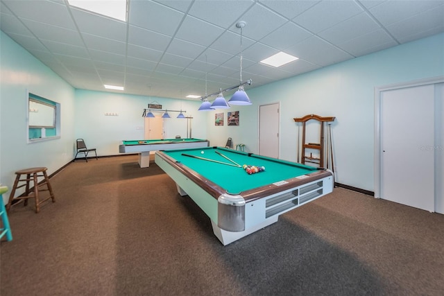 game room with dark carpet, a paneled ceiling, and billiards