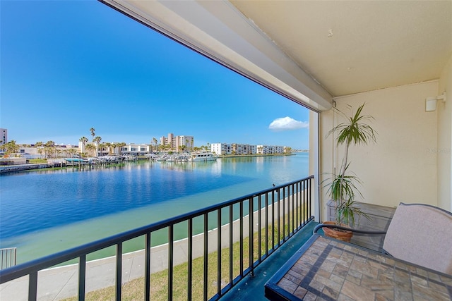 balcony featuring a water view