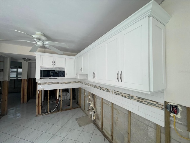 kitchen with ceiling fan, decorative backsplash, and white cabinets