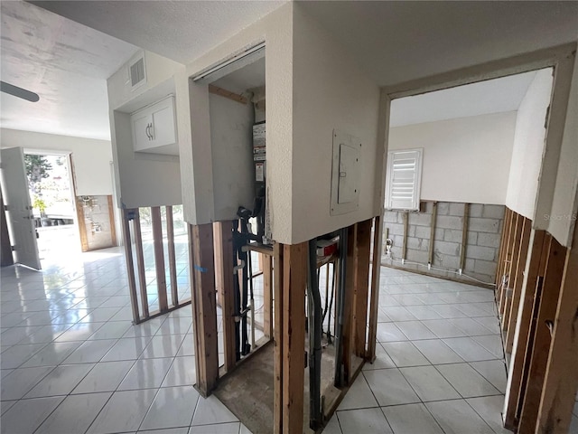 hall featuring light tile patterned floors