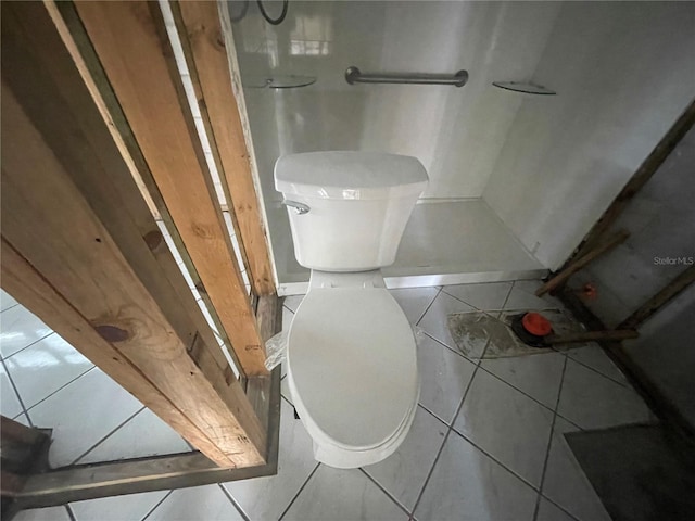 bathroom featuring tile patterned flooring and toilet