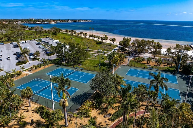 bird's eye view featuring a water view and a view of the beach