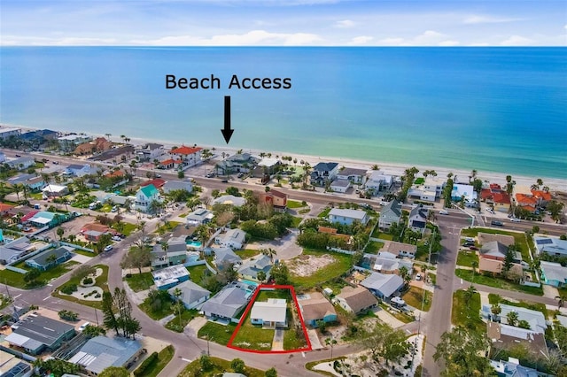 drone / aerial view featuring a view of the beach and a water view