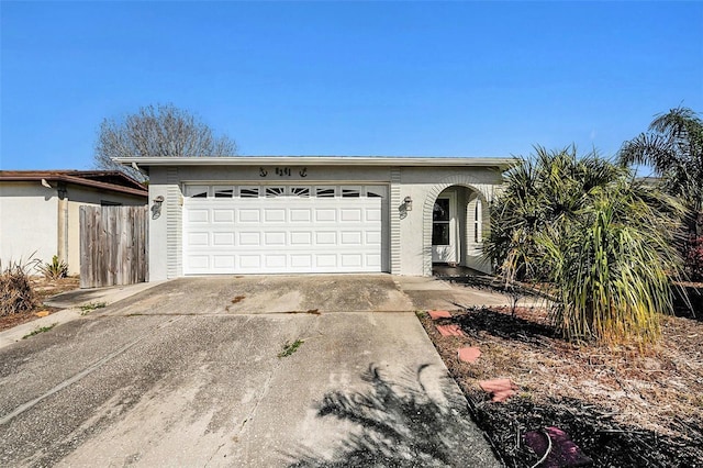 ranch-style house featuring a garage