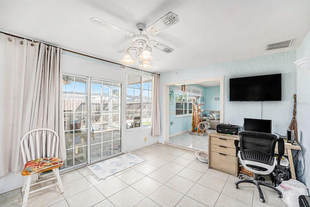 tiled office space with ceiling fan