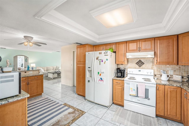 kitchen featuring decorative backsplash, ceiling fan, a tray ceiling, crown molding, and white appliances