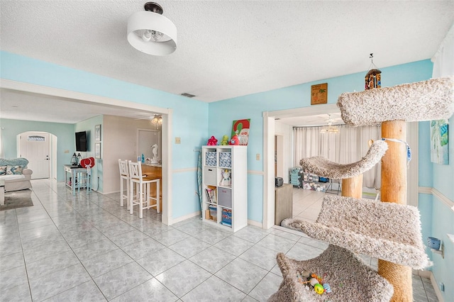 interior space with a textured ceiling