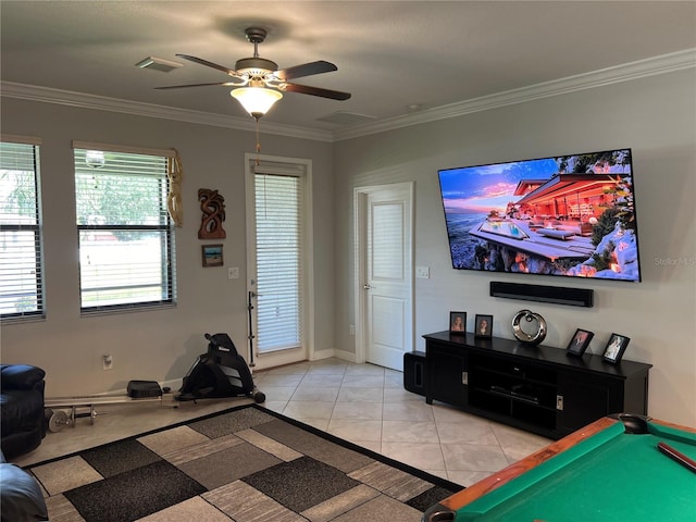 bedroom featuring light tile patterned floors, visible vents, ceiling fan, and crown molding