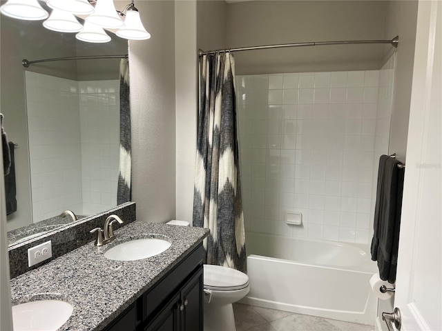 full bath featuring tile patterned floors, a sink, double vanity, shower / tub combo, and toilet