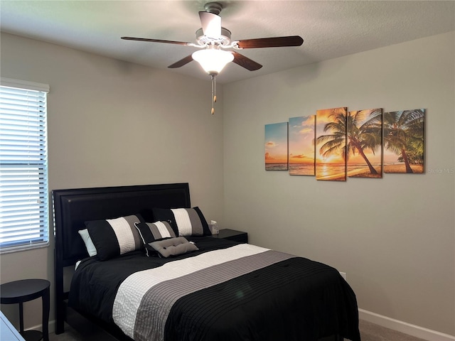 bedroom featuring carpet flooring, baseboards, and ceiling fan
