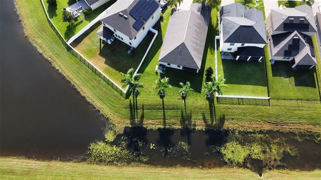 drone / aerial view featuring a residential view and a water view