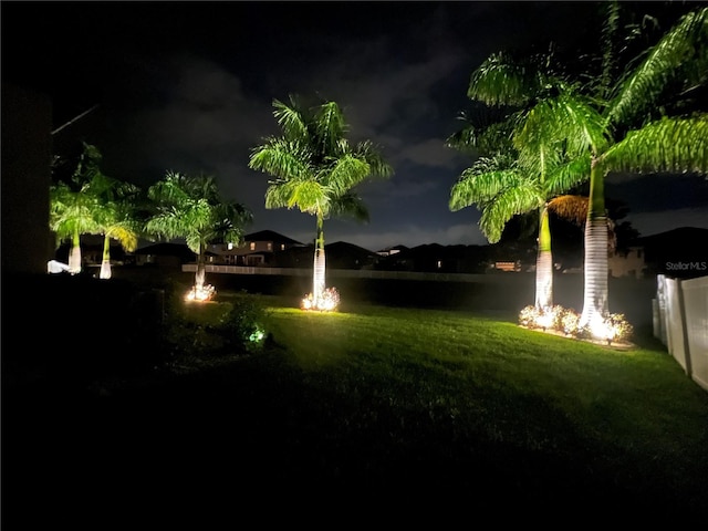 view of home's community with a yard