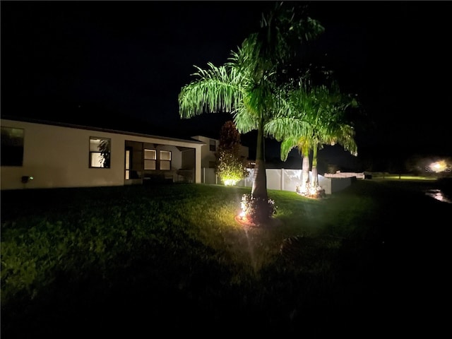 view of yard at night