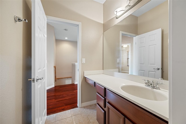 bathroom with tile patterned floors and vanity