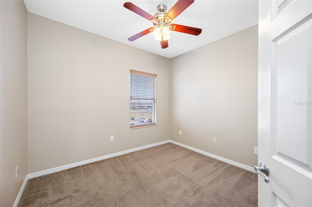 carpeted empty room featuring ceiling fan