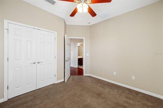 unfurnished bedroom featuring carpet floors, a closet, and ceiling fan