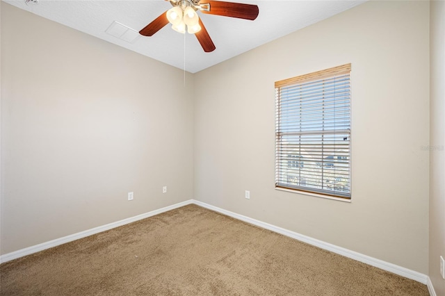 empty room featuring carpet floors and ceiling fan