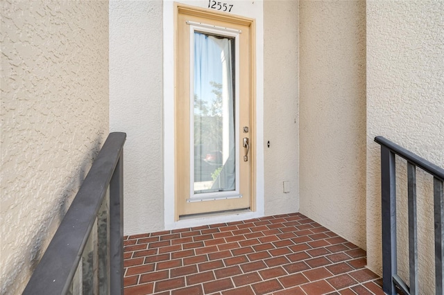 property entrance with a balcony