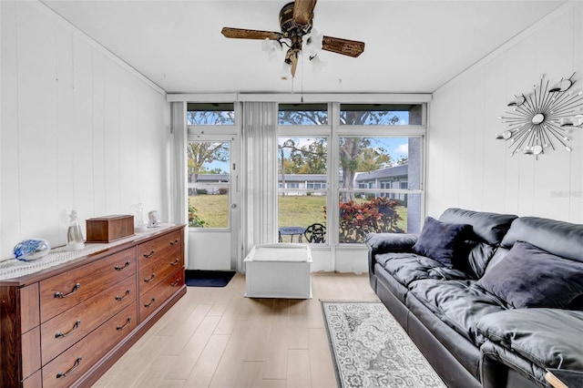 living room with ceiling fan and light hardwood / wood-style floors