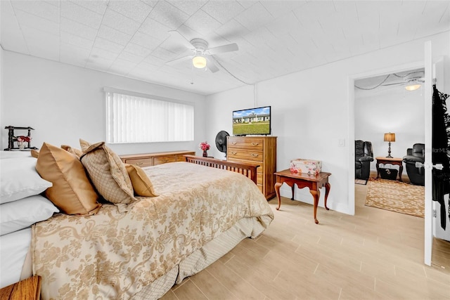 bedroom featuring ceiling fan and light wood-type flooring