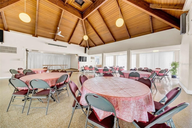 dining space featuring plenty of natural light, wooden ceiling, and beamed ceiling