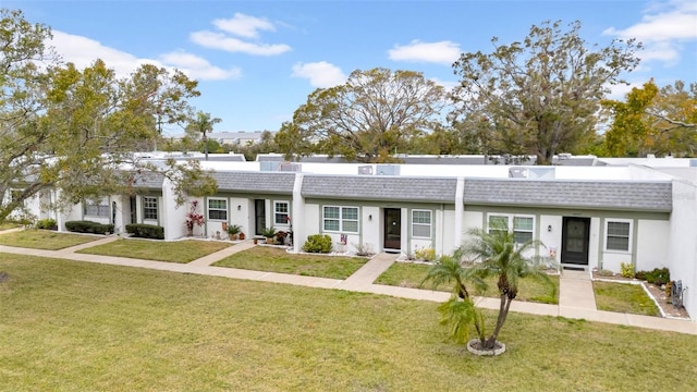 ranch-style home with a front lawn