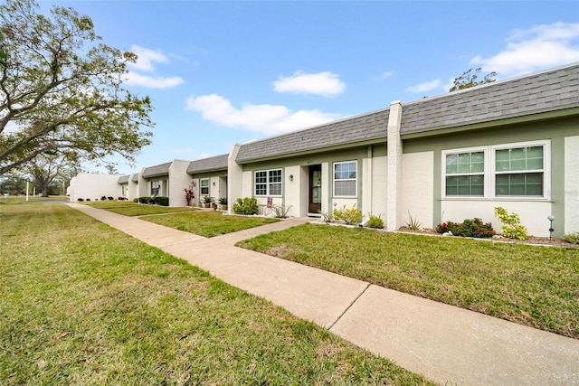 ranch-style house with a front yard