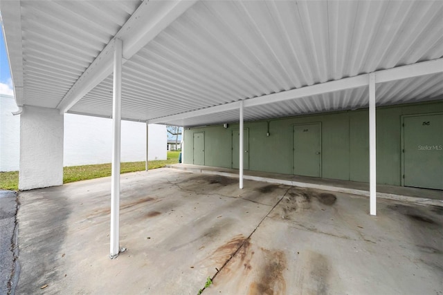 garage featuring a carport