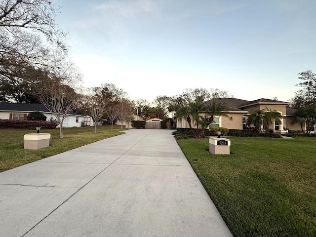 view of front of property with driveway and a front yard