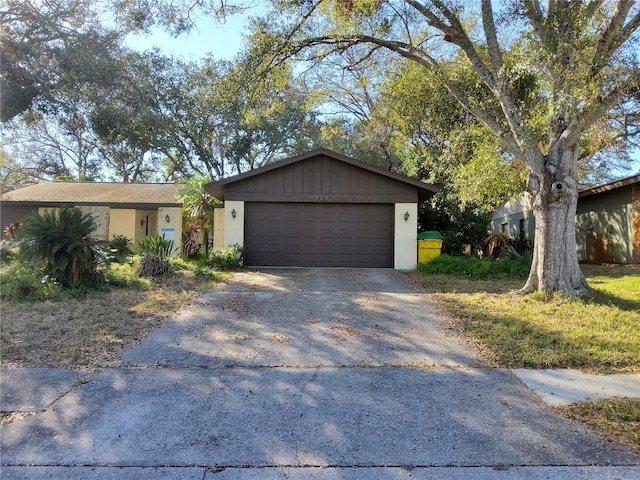 ranch-style home featuring a garage