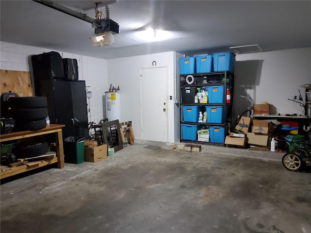 garage with a garage door opener and water heater