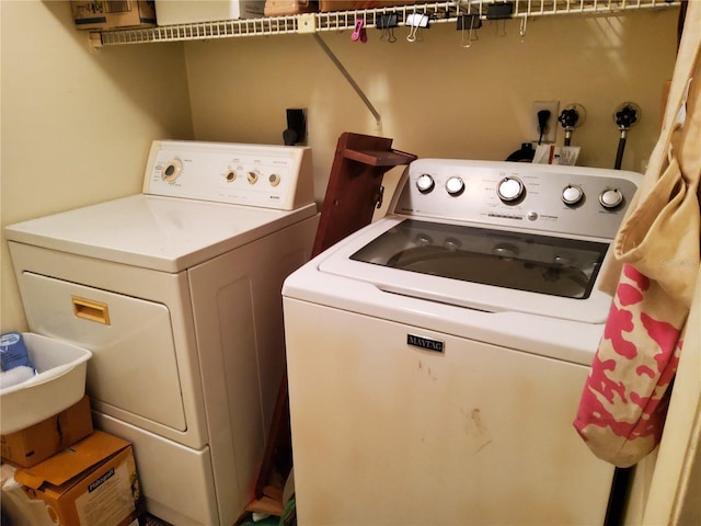 laundry room with separate washer and dryer