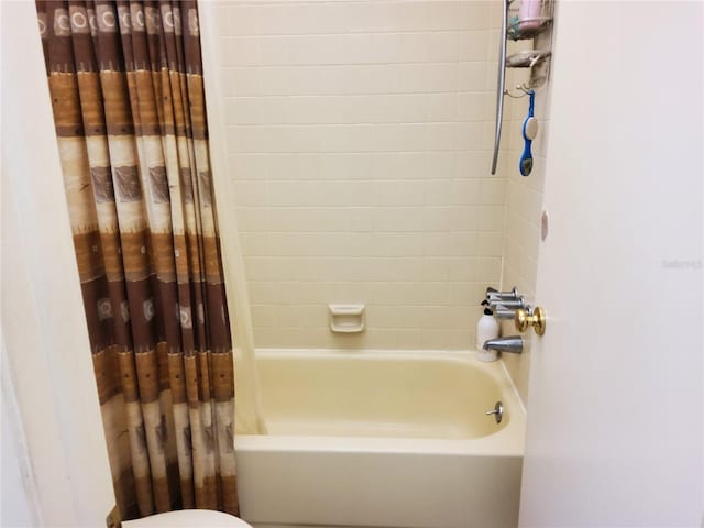 bathroom with shower / bath combo