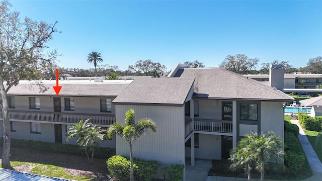 view of front of home with a shingled roof