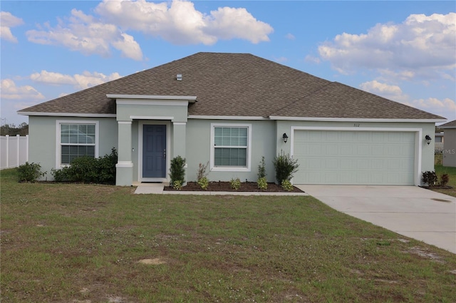 ranch-style house with a garage and a front lawn