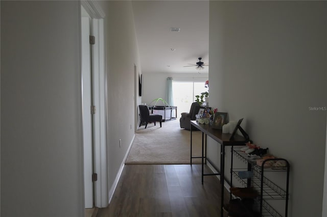 corridor with wood-type flooring