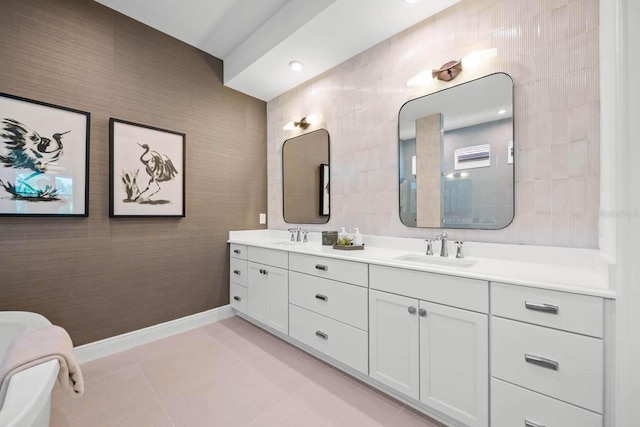 bathroom with tile patterned flooring, vanity, and tile walls