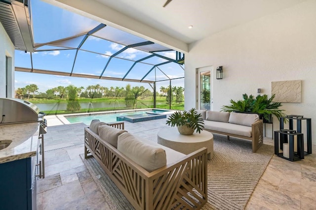 view of patio with an outdoor kitchen, a swimming pool with hot tub, an outdoor hangout area, glass enclosure, and a water view