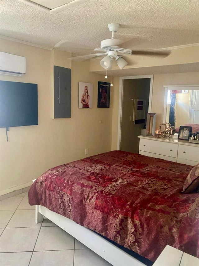 tiled bedroom featuring ceiling fan, electric panel, an AC wall unit, and a textured ceiling