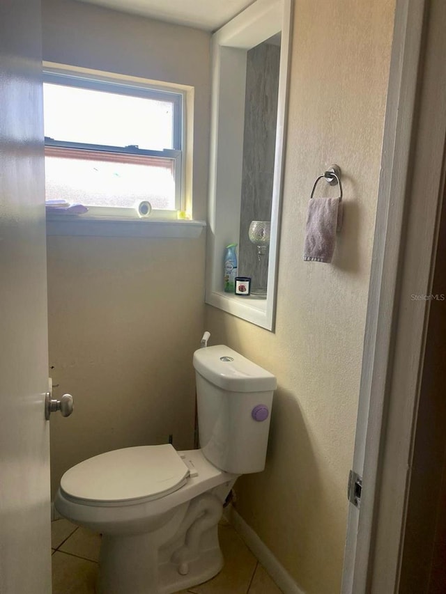 bathroom featuring tile patterned floors and toilet