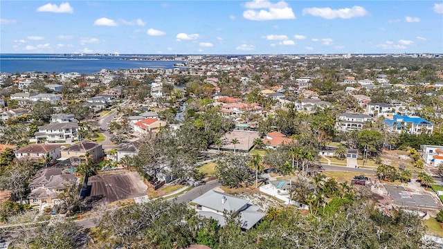 bird's eye view featuring a water view and a residential view