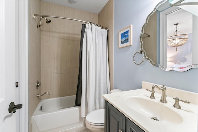 full bathroom featuring shower / bath combination with curtain, vanity, and toilet