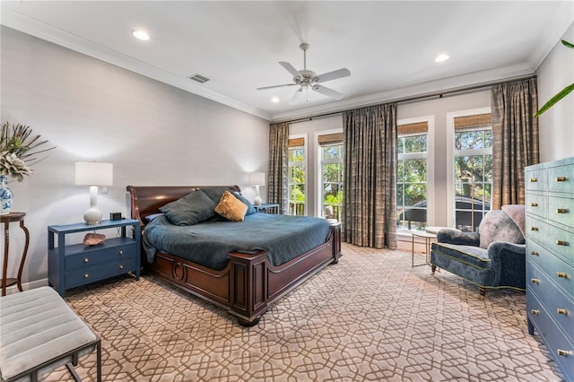 bedroom with crown molding, ceiling fan, and carpet flooring