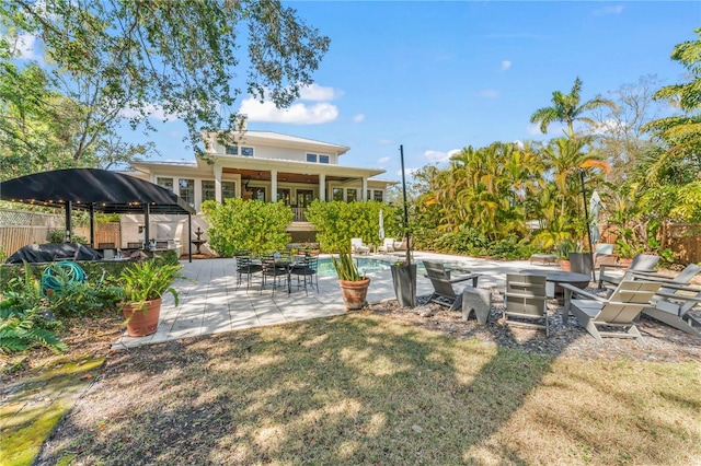 view of yard with a fenced in pool and a patio area